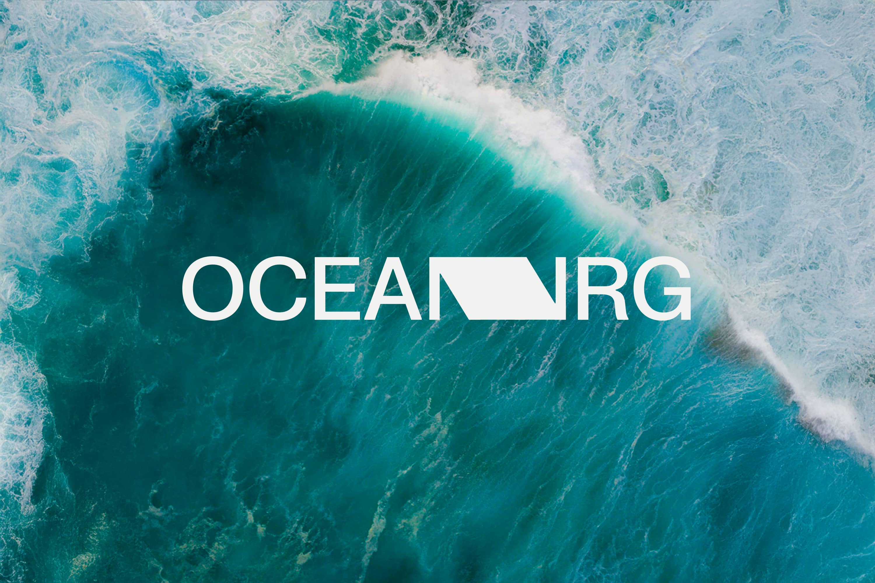 Ocean NRG wordmark over a breaking turquoise wave.