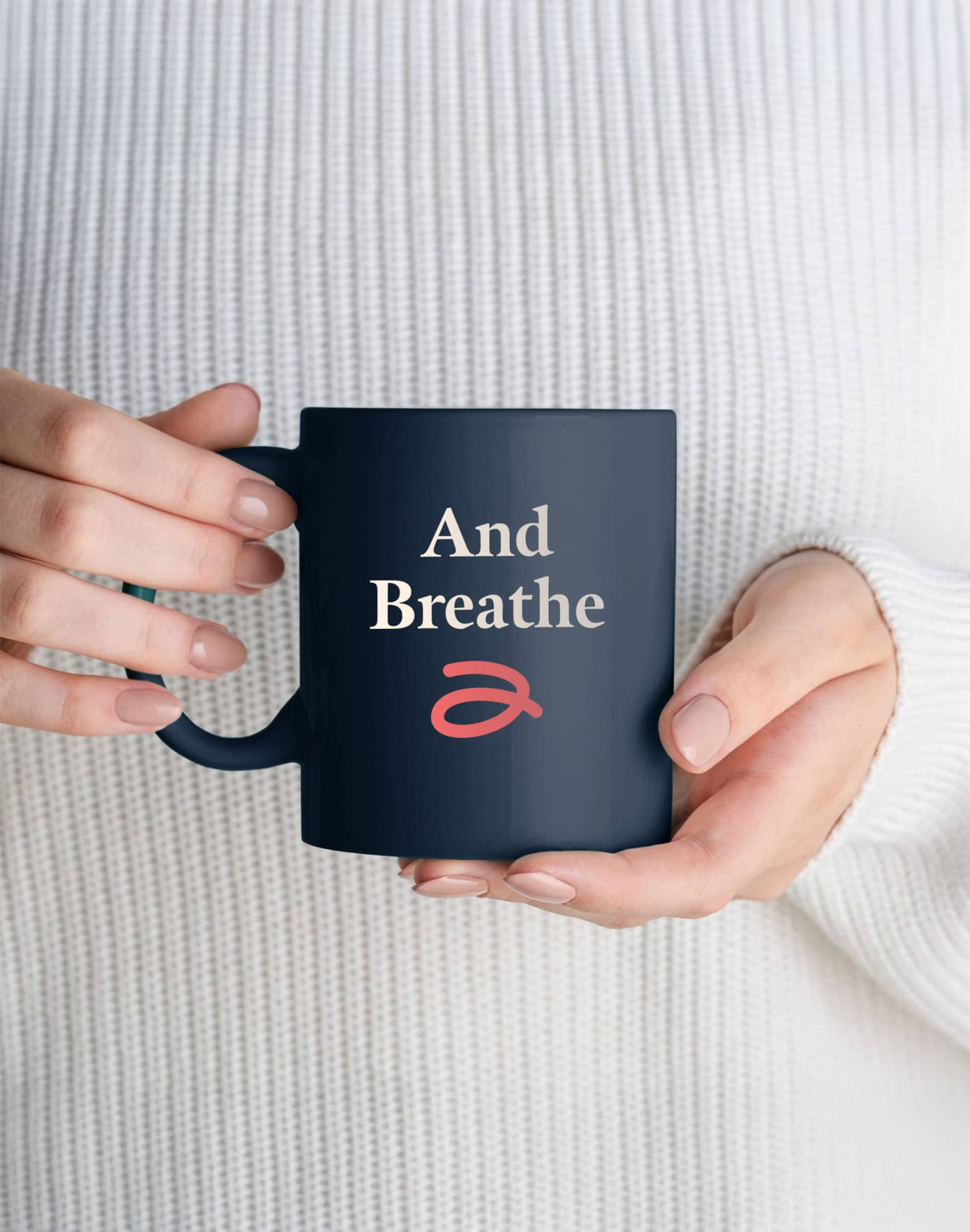 A navy Advice 1st mug with the words “And Breathe”.