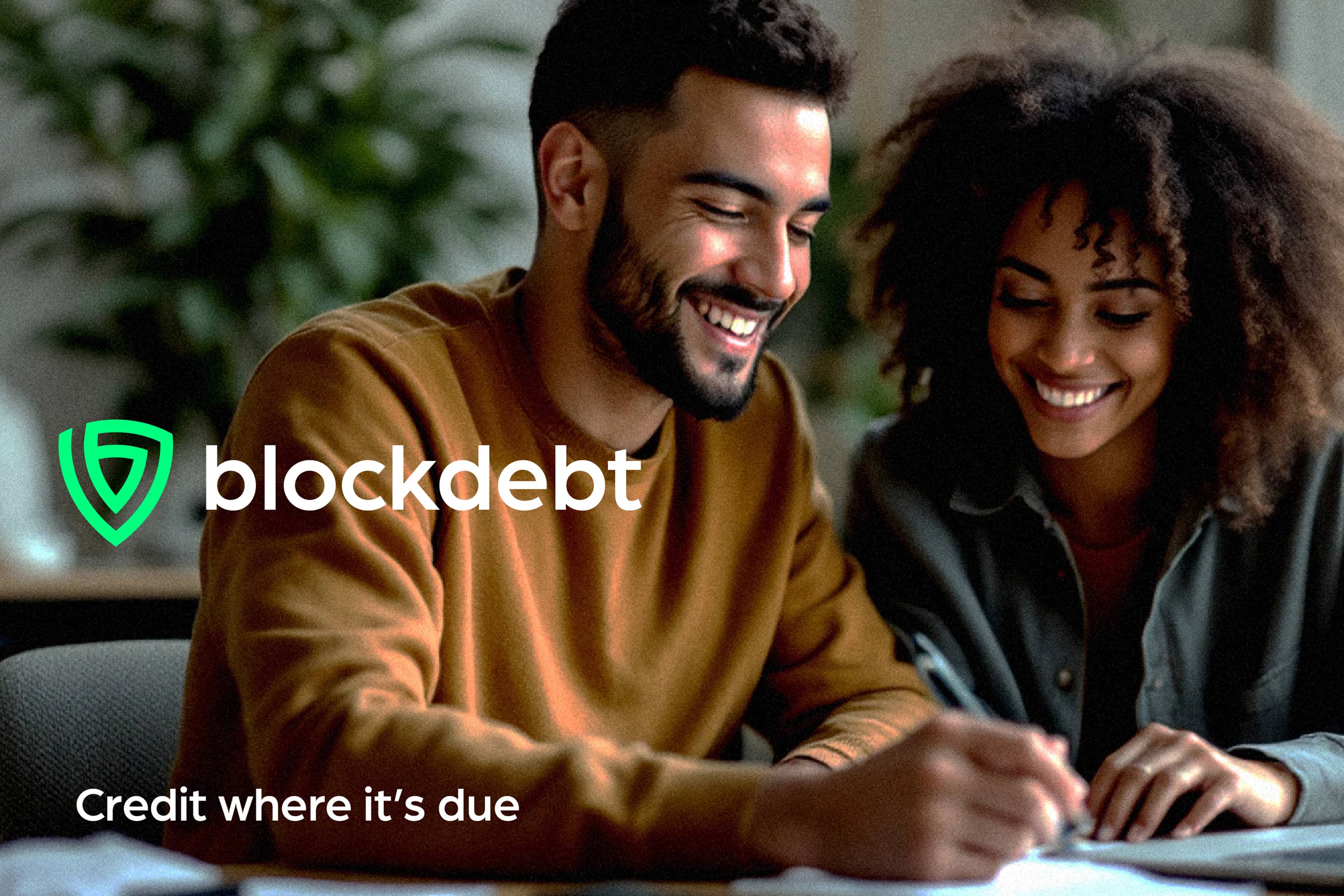 Block Debt campaign showing a couple using a tablet, with the headline “Credit where it’s due”.
