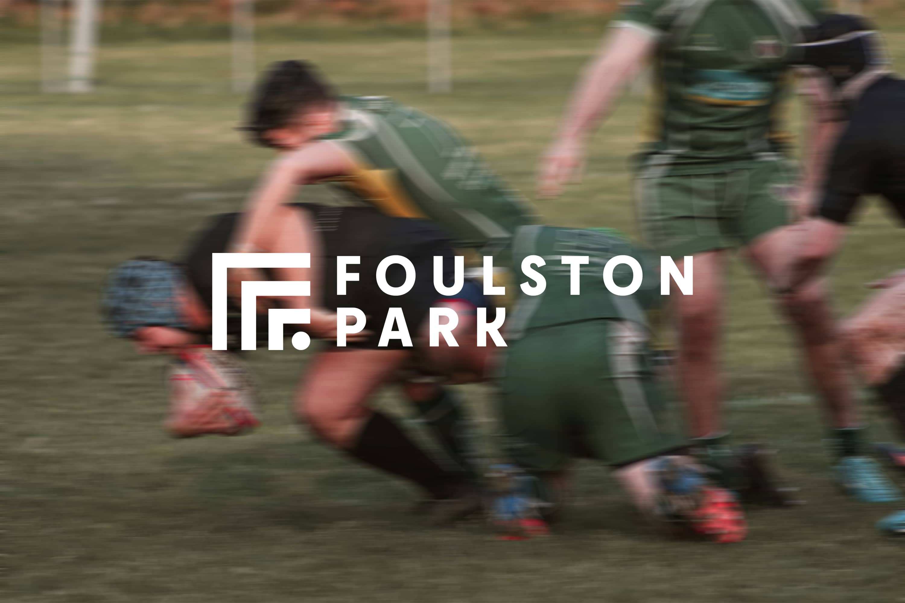 Foulston Park logo over a photograph of a rugby match.