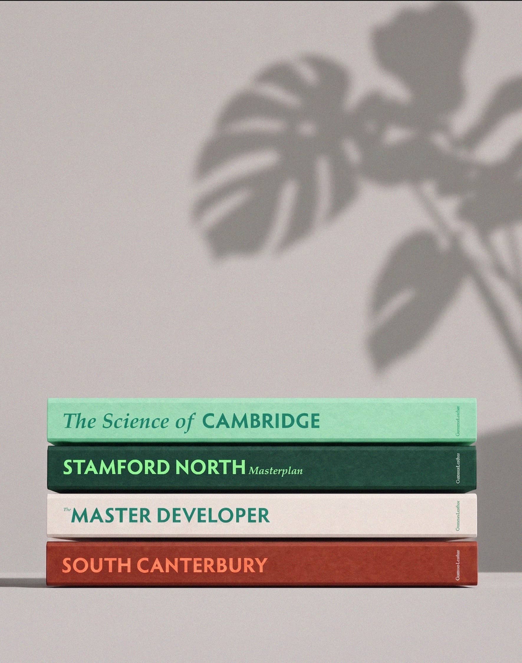 A stack of GummerLeathes project books with coloured spines.